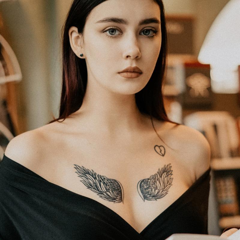 Back Of A Woman Wearing An Arm Tattoo That Has Wing Wings On Her Back  Background, Picture Of Angel Wing Tattoos, Angel Wings, Wing Background  Image And Wallpaper for Free Download